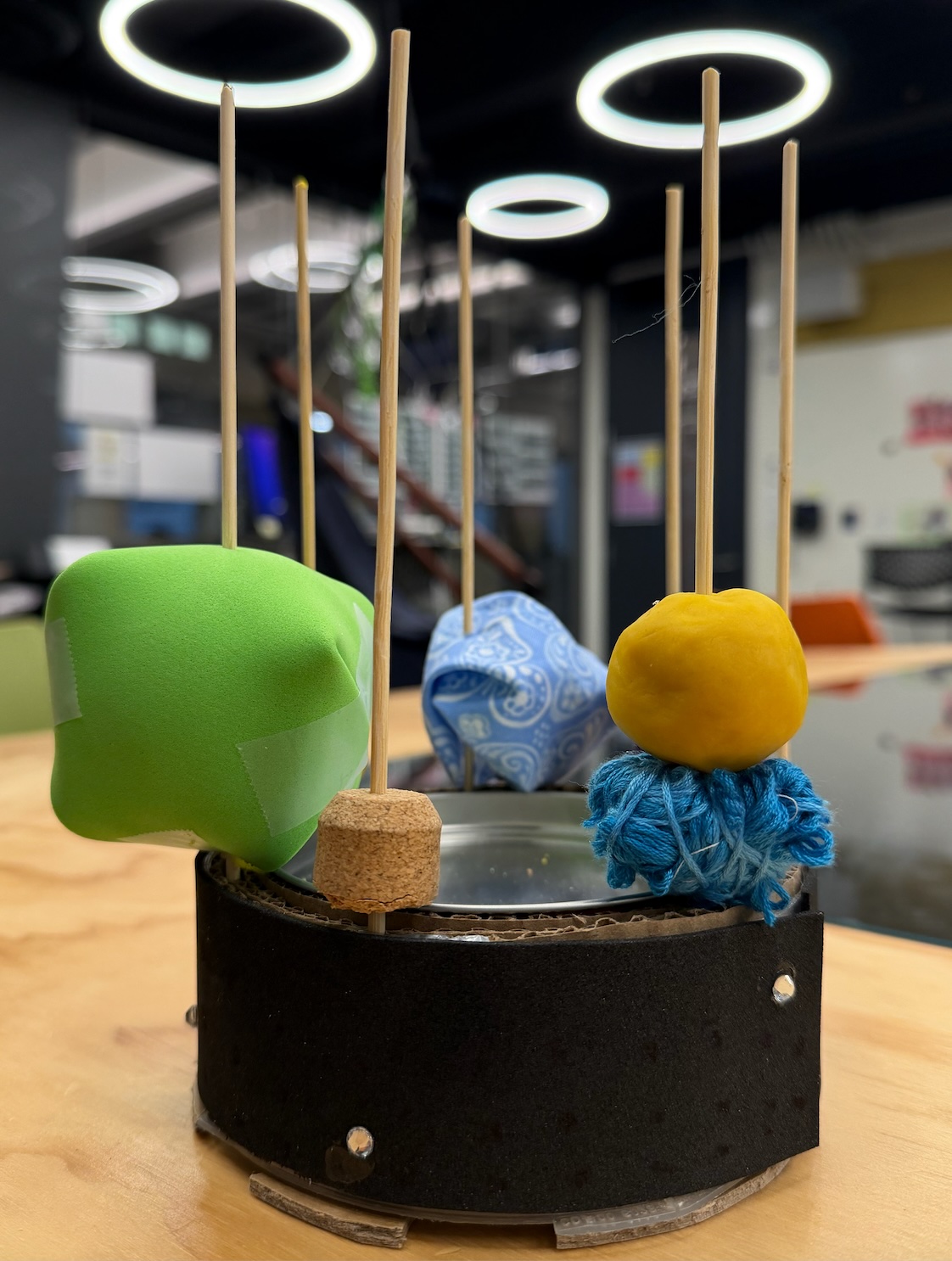 Early physical prototype with cookie tin base, skewers, and Play-Doh